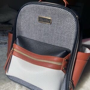 Itzy Ritzy Herringbone Colorblock Diaper Backpack in Black, White & Brown